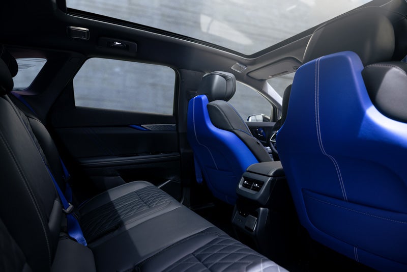 Back Seat View of the 2026 OPTIQ-V Blue Front Seats, Sun Roof, and Interior | Sarant Cadillac in Farmingdale NY